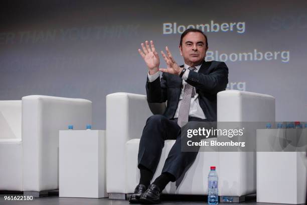 Carlos Ghosn, chairman of the alliance between Renault SA, Nissan Motor Co. And Mitsubishi Motors Corp., gestures while speaking during Bloomberg's...