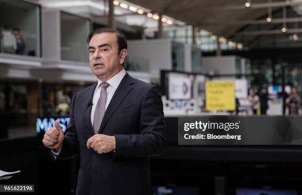 Carlos Ghosn, chairman of the alliance between Renault SA, Nissan Motor Co. And Mitsubishi Motors Corp., gestures while speaking during a Bloomberg...
