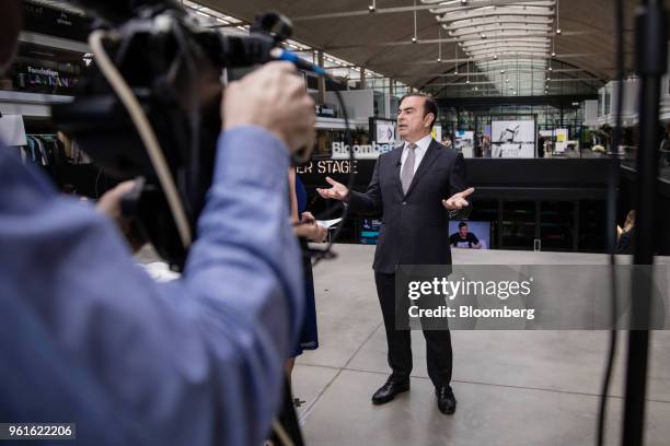 Carlos Ghosn, chairman of the alliance between Renault SA, Nissan Motor Co. And Mitsubishi Motors Corp., gestures while speaking during a Bloomberg...