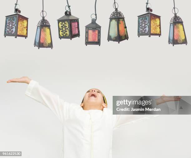 child with lanterns in ramadan - persian gulf stock pictures, royalty-free photos & images