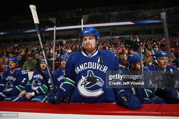 Henrik Sedin of the Vancouver Canucks stretches his back on the bench during their game against the Dallas Stars at General Motors Place on January...