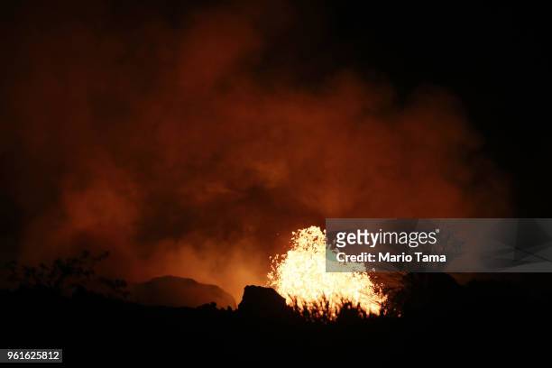 Lava erupts from a Kilauea volcano fissure on Hawaii's Big Island on May 22, 2018 in Kapoho, Hawaii. Officials are concerned that 'laze', a dangerous...
