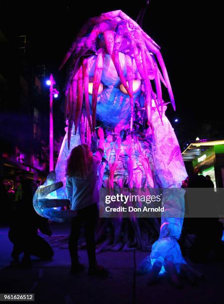 Eva Milkovic gazes into the eyes of the puppet creature named Marri Dyin during a media preview for Vivid Sydney on May 23, 2018 in Sydney,...