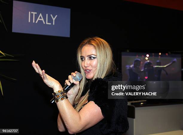 Patrizia d'Addario, the call girl who claims she spent a night with Italian Prime Minister Silvio Berlusconi, sings "All you Want", as she presents...