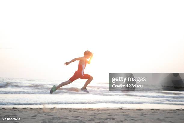 exercising at beach - 123ducu stock pictures, royalty-free photos & images
