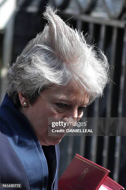 Britain's Prime Minister Theresa May leaves 10 Downing Street in central London on May 23 as she heads to the weekly Prime Minister's Questions...