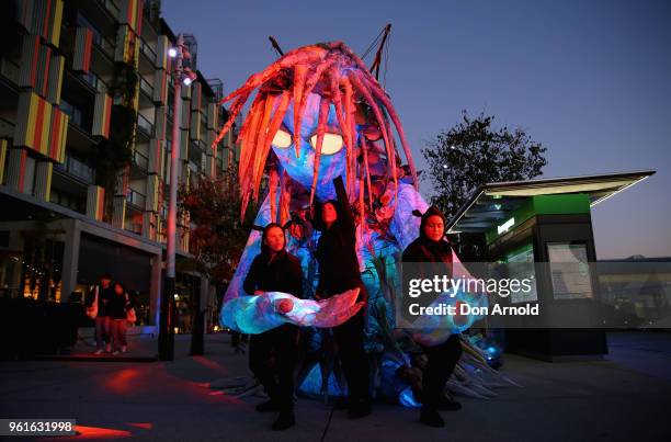 Handlers attend to the puppet creature named Marri Dyin during a media preview for Vivid Sydney on May 23, 2018 in Sydney, Australia. Vivid Sydney is...