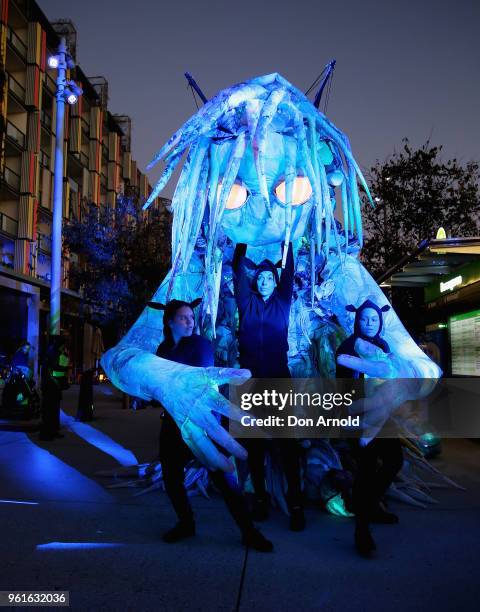 Handlers attend to the puppet creature named Marri Dyin during a media preview for Vivid Sydney on May 23, 2018 in Sydney, Australia. Vivid Sydney is...