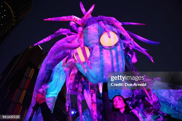 Handlers attend to the puppet creature named Marri Dyin during a media preview for Vivid Sydney on May 23, 2018 in Sydney, Australia. Vivid Sydney is...