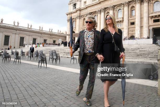 Singer Rod Stewart and his wife, Penny Lancaster leave St. Peter's square at the end of Pope Francis' weekly audience on May 23, 2018 in Vatican...