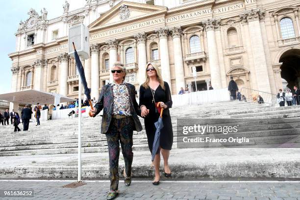 Singer Rod Stewart and his wife, Penny Lancaster leave St. Peter's square at the end of Pope Francis' weekly audience on May 23, 2018 in Vatican...