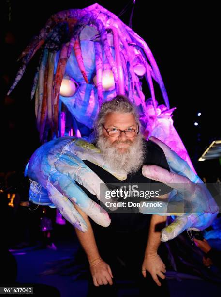 Creative Director of Erth Visual and Physical Inc. Scott Wright poses in front of the puppet creature Marri Dyin during a media preview for Vivid...