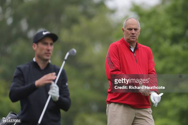 Sir Steve Redgrave looks on with Ross Fisher of England during the Pro Am for the BMW PGA Championship at Wentworth on May 23, 2018 in Virginia...