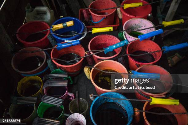 buckets of colours - kota bharu stock pictures, royalty-free photos & images