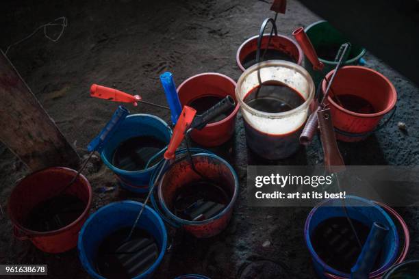 buckets with liquid colouring - kota bharu stock pictures, royalty-free photos & images