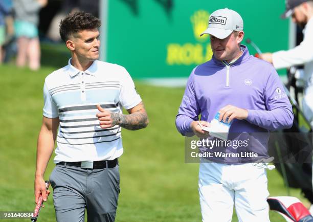 Reality TV star Gary Beadle and Jamie Donaldson of Wales in discussion during the BMW PGA Championship Pro Am tournament at Wentworth on May 23, 2018...