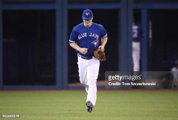 Aaron Loup of the Toronto Blue Jays jogs in from the bullpen during a pitching change in the eighth inning during MLB game action against the Oakland...