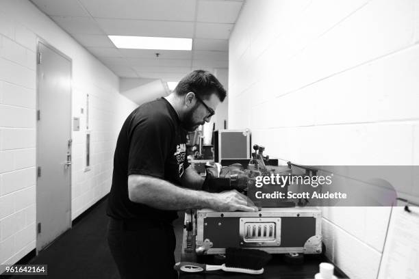 Head Equipment Manager Ray Thill of the Tampa Bay Lightning sharpens a skate before the game against the Washington Capitals during Game Six of the...