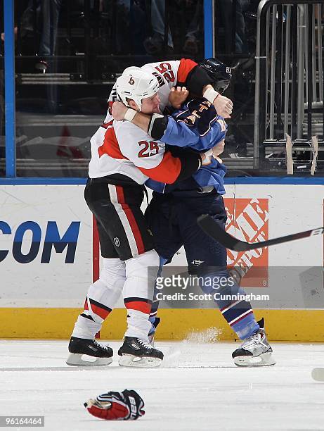 Chris Neil of the Ottawa Senators fights against Eric Boulton of the Atlanta Thrashers at Philips Arena on January 12, 2010 in Atlanta, Georgia.