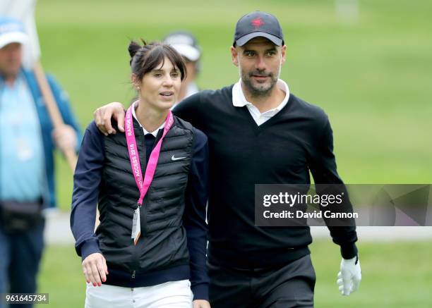 Pep Guardiola of Spain the Manchester City Football Club manager walks with his wife Cristina Serra during the pro-am for the 2018 BMW PGA...