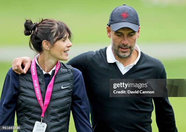 Pep Guardiola of Spain the Manchester City Football Club manager walks with his wife Cristina Serra during the pro-am for the 2018 BMW PGA...