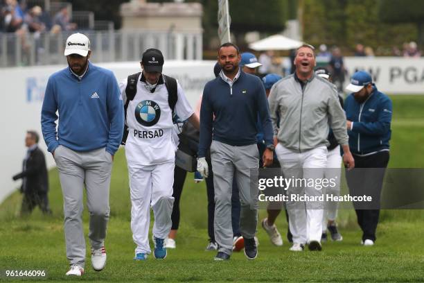 Rishi Persad and Sir Matthew Pinsent walk together during the Pro Am for the BMW PGA Championship at Wentworth on May 23, 2018 in Virginia Water,...