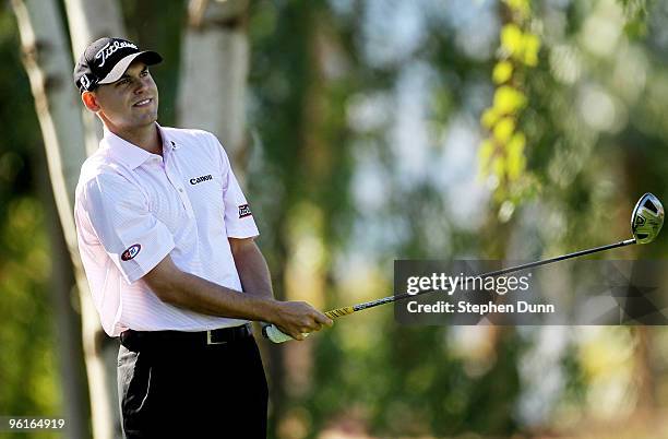 Bill Haas watches his tee shot on the second hole at the Palmer Private course at PGA West during the final round of the Bob Hope Classic on January...