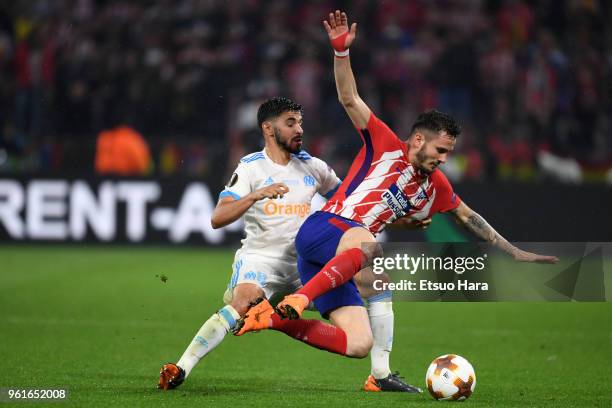 Saul Niguez of Atletico Madrid is challenged by Morgan Sanson of Olympique Marseille during the UEFA Europa League Final between Olympique de...