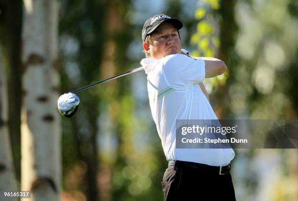 Tim Clark of South Africa hits his tee shot on the second hole at the Palmer Private course at PGA West during the final round of the Bob Hope...