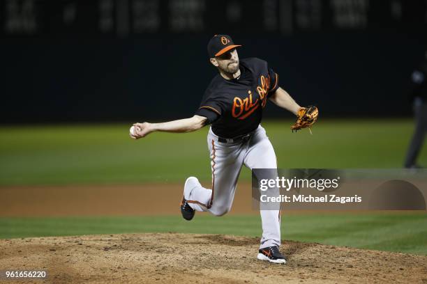 Darren O'Day of the Baltimore Orioles pitches during the game against the Oakland Athletics at the Oakland Alameda Coliseum on May 4, 2018 in...