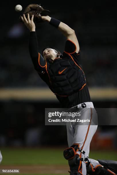 Caleb Joseph of the Baltimore Orioles misplays a pop-up during the game against the Oakland Athletics at the Oakland Alameda Coliseum on May 4, 2018...