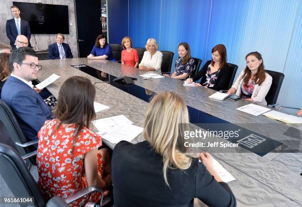 Camilla, Duchess of Cornwall speaks members of the 5 News team, including journalist Sian Williams as she visits the headquarters of Independent...