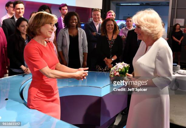Camilla, Duchess of Cornwall speaks with journalist Sian Williams as she visits the headquarters of Independent Television News Ltd to mark the 21st...