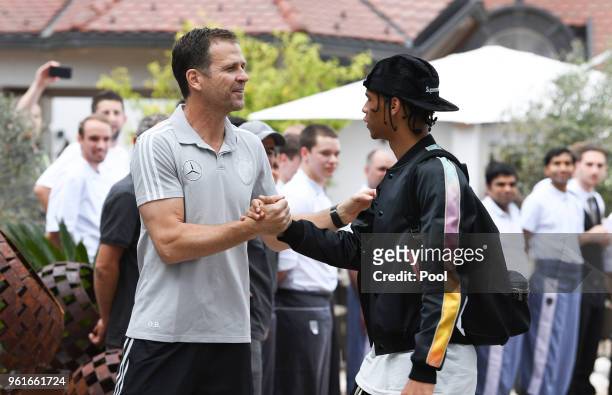 Team Manager, Olivier Bierhoff greets Leroy Sane as he arrives on day one of the Germany National Football team's training camp at Hotel Weinegg on...