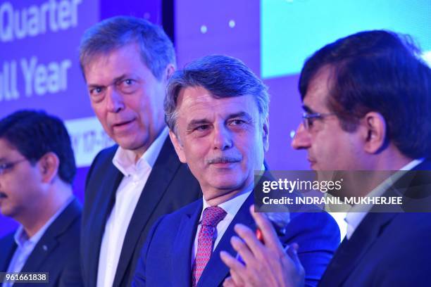 And Managing Director of Tata Motors Guenter Butschek and chief executive officer of Jaguar Land Rover Ralf Speth look on as president of Commercial...