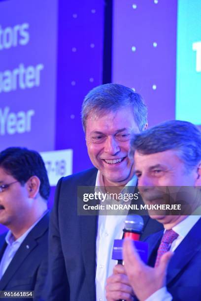 And Managing Director of Tata Motors Guenter Butschek looks on as chief executive officer of Jaguar Land Rover Ralf Speth speaks at a press...