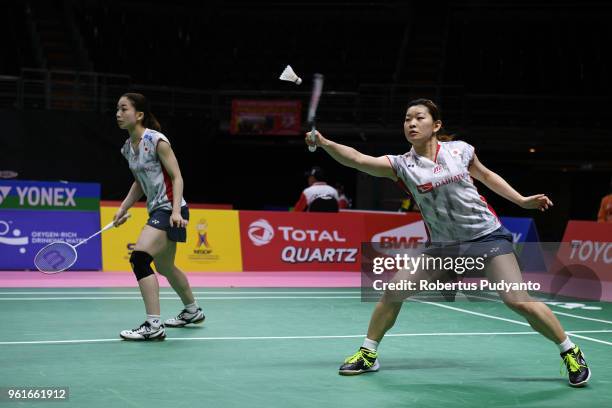 Misaki Matsutomo and Ayaka Takahashi of Japan compete against Sanyogita Ghorpade and Prajakta Sawant of India during Preliminary Round on day four of...