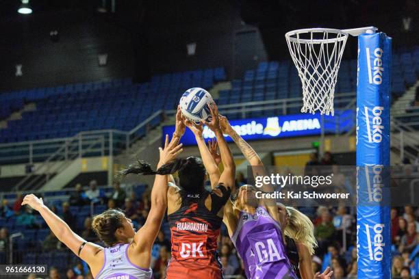 Maia Wilson of the Northern Stars, Temalisi Fakahokotau of the Tactix and Paula Griffin of the Northern Stars compete for the ball during the round...