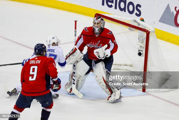 Yanni Gourde of the Tampa Bay Lightning against Dmitry Orlov and goalie Braden Holtby of the Washington Capitals during Game Six of the Eastern...