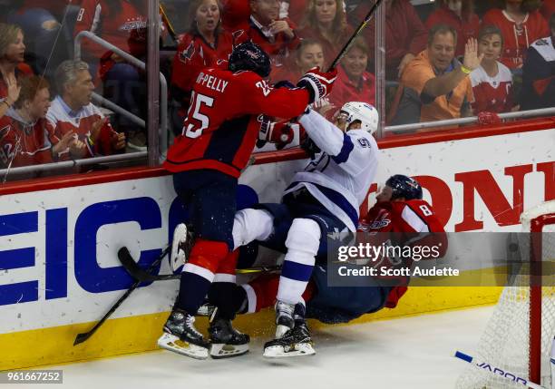 Dan Girardi of the Tampa Bay Lightning is checked by Devante Smith-Pelly of the Washington Capitals during Game Six of the Eastern Conference Final...