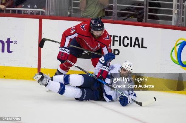 Cedric Paquette of the Tampa Bay Lightning against John Carlson of the Washington Capitals during Game Six of the Eastern Conference Final during the...