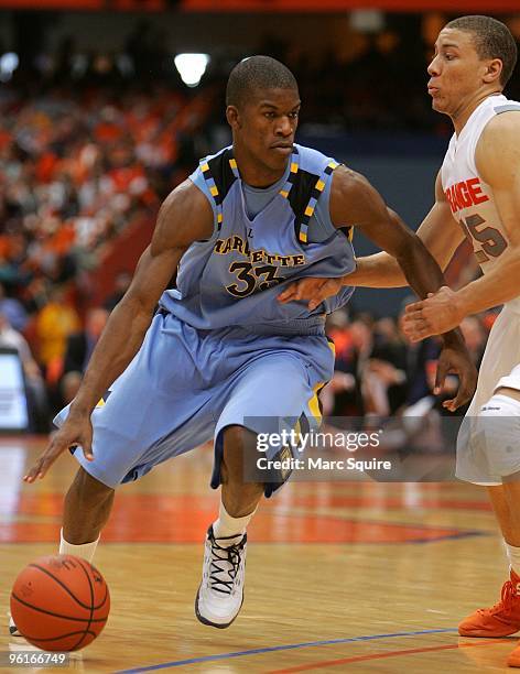 Jimmy Butler of the Marquette Golden Eagles drives past Brandon Triche of the Syracuse Orange during the game at Carrier Dome on January 23, 2010 in...