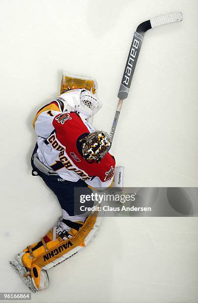 Adam Courchaine of the Erie Otters stretches in the warm-up prior to a game against the London Knights on January 22, 2010 at the John Labatt Centre...