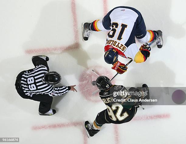 Shawn Szydlowski of the Erie Otters takes a faceoff against Daniel Erlich of the London Knights in a game on January 22, 2010 at the John Labatt...