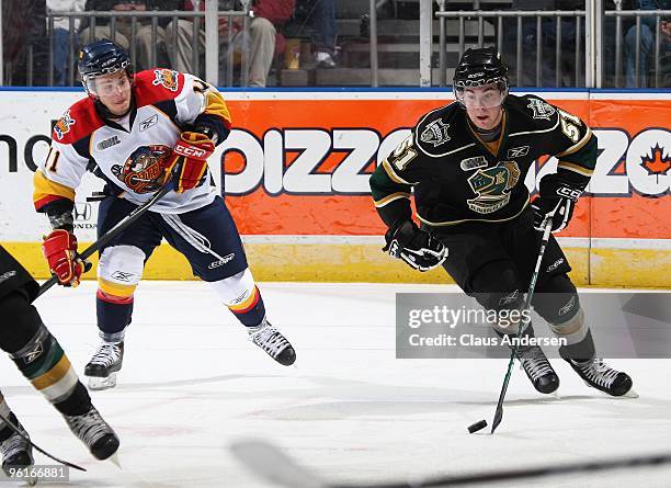 Michael D'Orazio of the London Knights skates with the puck away from Anthony Luciani of the Erie Otters in a game on January 22, 2010 at the John...