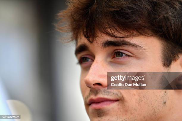 Charles Leclerc of Monaco and Sauber F1 looks on in the Paddock during previews ahead of the Monaco Formula One Grand Prix at Circuit de Monaco on...