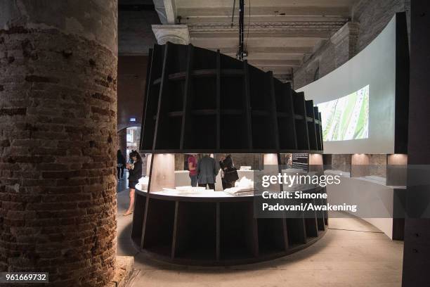 Visitors look at the Alvaro Siza installation in the Corderie of Arsenale at the 16th International Architecture Biennale on May 23, 2018 in Venice,...