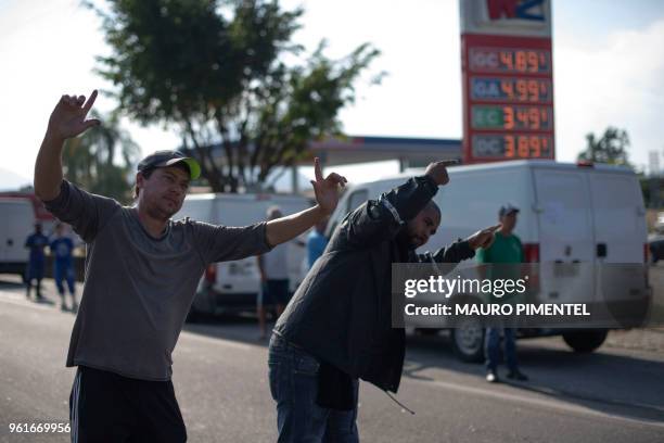 Brazilian truck drivers partially block Santos Dumont road , near the city of Mage, in Rio de Janeiro state, Brazil during a strike to protest...