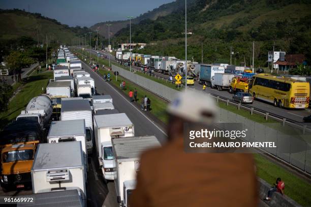 Brazilian truck drivers partially block Santos Dumont road , near the city of Mage, in Rio de Janeiro state, Brazil during a strike to protest...