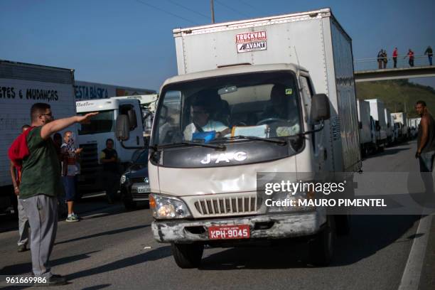 Brazilian truck drivers partially block Santos Dumont road , near the city of Mage, in Rio de Janeiro state, Brazil during a strike to protest...